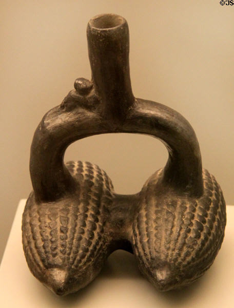 Chimu culture ceramic stirrup-spout bottle with two ears of corn (1100-1400) from Peru at Museum of America. Madrid, Spain.