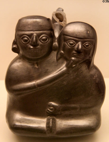 Chimu culture ceramic stirrup-spout bottle with loving couple (1100-1400) from Peru at Museum of America. Madrid, Spain.