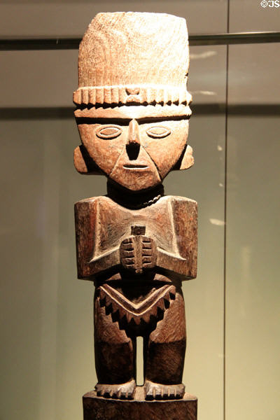 Chimu culture wood carving male figure for offering (1100-1400) from Peru at Museum of America. Madrid, Spain.