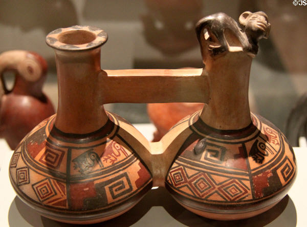 Chimu culture ceramic stirrup-spout twin bottle with monkey (1400-1533) from Peru at Museum of America. Madrid, Spain.