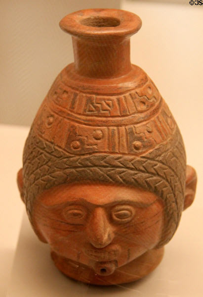 Inca ceramic bottle with human face (1400-1533) from Peru at Museum of America. Madrid, Spain.