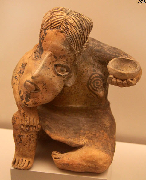 Nayarit culture ceramic sitting female figure with humpback (500 BCE - 200 CE) from Western Mexico at Museum of America. Madrid, Spain.