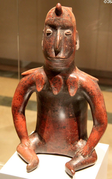 Colima culture ceramic sitting male figure with collar (100-700 CE) from Western Mexico at Museum of America. Madrid, Spain.