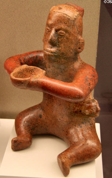 Colima culture ceramic sitting figure with bowl (100-400 CE) from Western Mexico at Museum of America. Madrid, Spain.