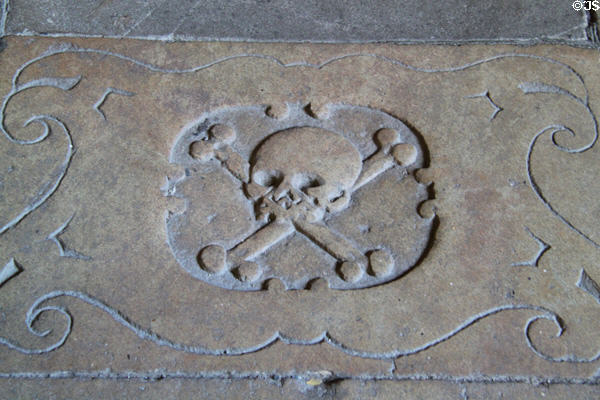 Skull & crossbones carving on floor of at Barcelona Cathedral. Barcelona, Spain.