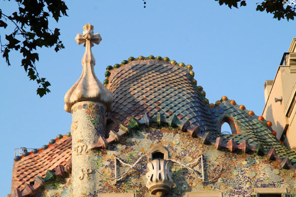3-D cross & undulating tile roof atop Casa Batlló. Barcelona, Spain.