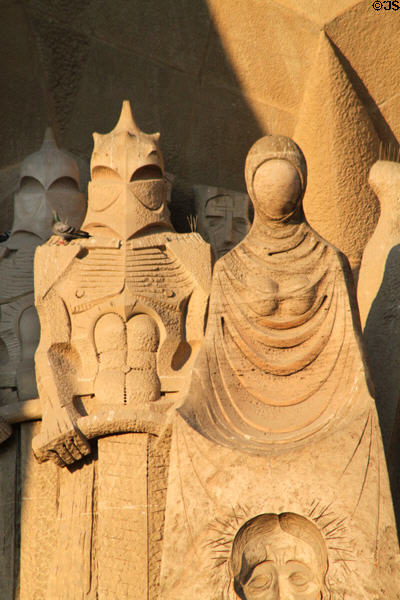 Roman soldiers & Veronica holding cloth with image of Christ's face on Passion Facade at Sagrada Familia. Barcelona, Spain.