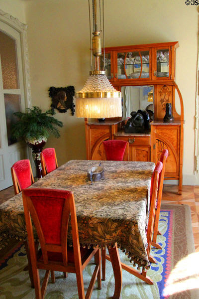 Dining room with Art Nouveau furniture in museum apartment at Casa Milà. Barcelona, Spain.