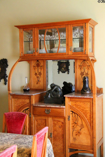 Art Nouveau (Modernista) sideboard in dining room of museum apartment at Casa Milà. Barcelona, Spain.