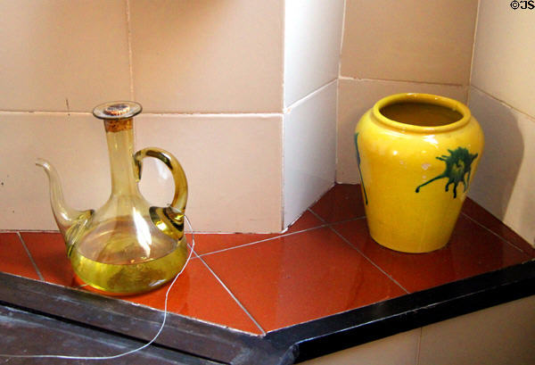 Glass flask & ceramic jar in kitchen of museum apartment at Casa Milà. Barcelona, Spain.