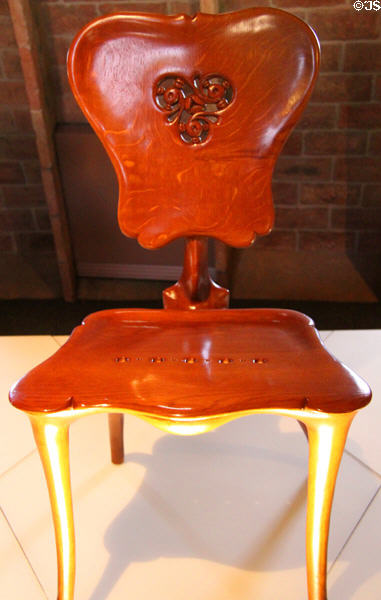 Modernista chair replica (c1900) from Casa Calvet in Barcelona by Antoni Gaudí at Casa Milà. Barcelona, Spain.