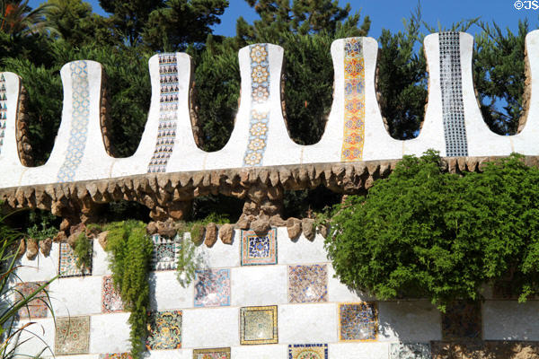 Mosaic walls flanking entrance steps of Parc Güell. Barcelona, Spain.