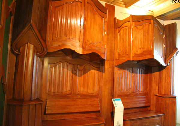 Modernista wardrobes designed to fit irregular walls of Casa Milà in Barcelona by Antoni Gaudí at Gaudi House Museum in Parc Güell. Barcelona, Spain.