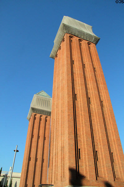 Venetian towers (1929) (47m / 154ft) (modeled on Bell Tower of St Mark's Square in Venice) were built for the International Exhibition. Barcelona, Spain. Architect: Ramon Raventós.