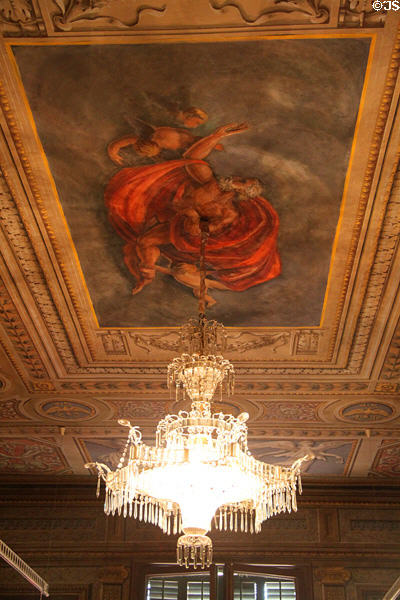 Chandelier hanging from ceiling mural at Palau Reial. Barcelona, Spain.