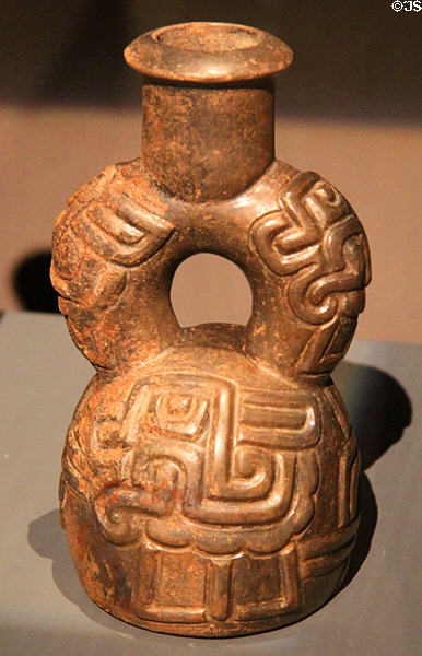 Ceramic stirrup-handle vessel (900-400 BCE) from Cupisnique Culture, Peru at Barbier Mueller Precolumbian Art Museum. Barcelona, Spain.