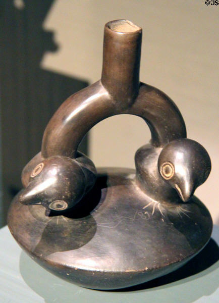 Ceramic stirrup-handle vessel with birds (1100-1450) from Chimu Culture, Peru at Barbier Mueller Precolumbian Art Museum. Barcelona, Spain.