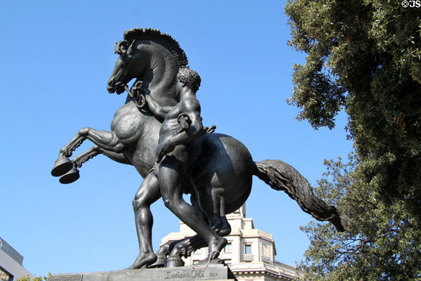 Man with hammer leading horse in Work sculpture (1929) by Luciano Oslé Saenz de Medrano in Plaça de Catalunya. Barcelona, Spain.