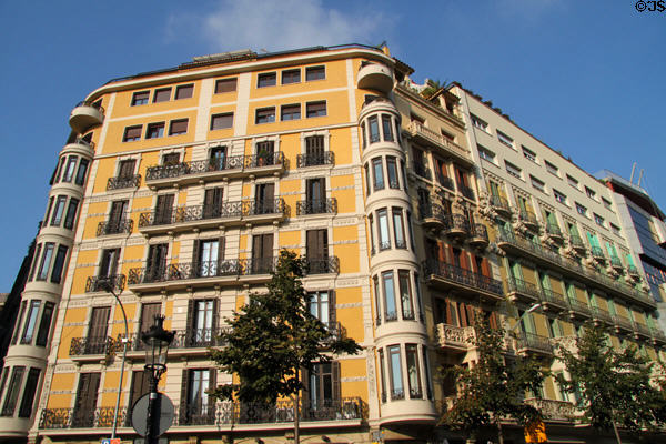 Typical corner building in Eixample district at Rambla de Catalunya & Carrer del Rosselló. Barcelona, Spain.