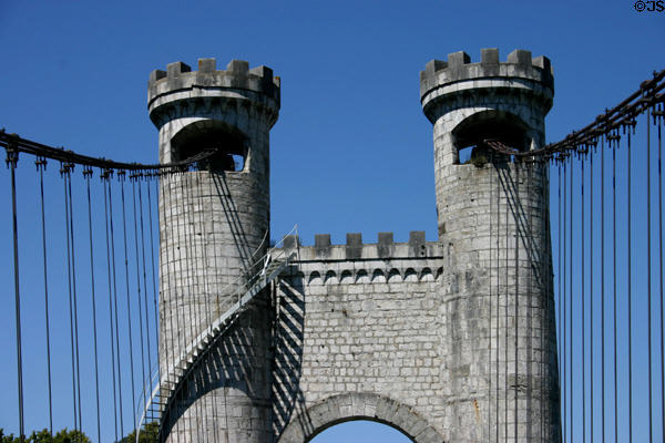 Stone towers of Pont de la Caille (1838) with castle-like fenestrations. Annecy, France.