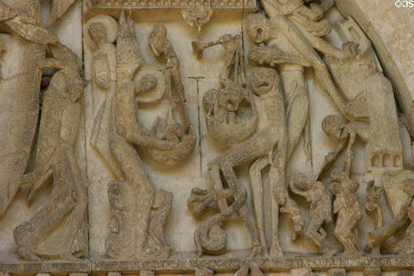Detail of weighing of soles at Last Judgment on tympanum of Cathedral St. Lazarre. Autun, France.