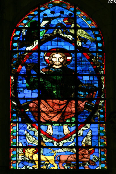 Stained glass window of Christ with four Apostles in Cathedral St. Étienne. Auxerre, France.