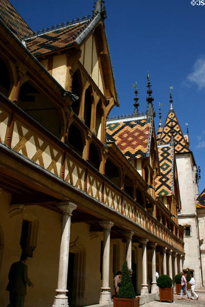 Arcade & half-timbering in courtyard of Hotel Dieu. Beaune, France.
