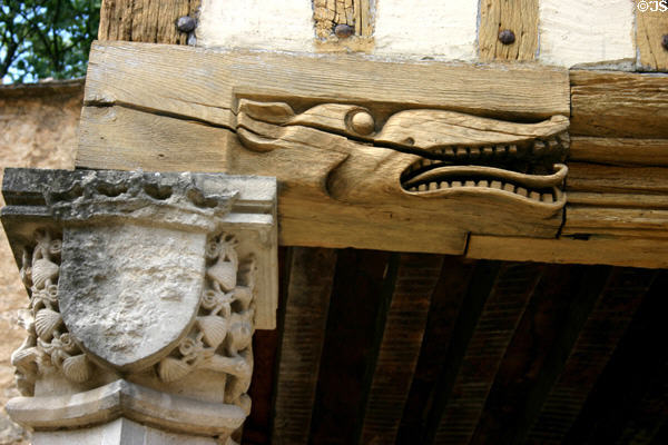 Carved animal on support beam where mansion of the Dukes of Burgundy meets town ramparts. Beaune, France.
