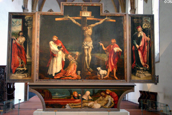 Isenheim Altarpiece (1512) by Matthius Grünewald in Unterlinden Museum showing Crucifixion, entombment, St Sebastian (left), St Anthony (rt). Colmar, France.