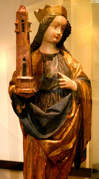 Wooden statue of St Barbara with her tower (c1460) from upper Rhine in Unterlinden Museum. Colmar, France.