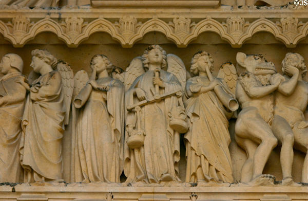 Weighing of souls at Last Judgment on tympanum of Cathedral. Metz, France.