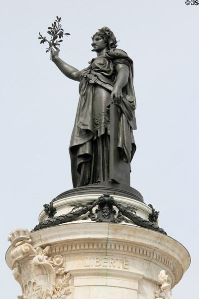 Bronze Marianne symbol of France atop monument (1883) by Léopold Morice to mark 90th anniversary of French Revolution at Place Republique. Paris, France.