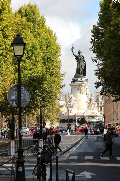 Place de la République monument at end of city street. Paris, France.