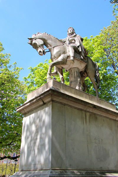 Equestrian statue (1829) of Louis XIII 1610-1643 at center of Place des Vosges garden. Paris, France.