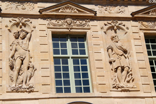 Carved relief details of Hotel de Sully. Paris, France.
