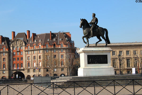 Equestrian Statue of King Henri IV with left bank buildings at end of Pont Neuf Bridge. Paris, France.