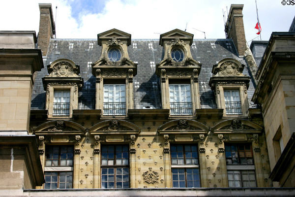 Facade details of older section of Palais de Justice. Paris, France.