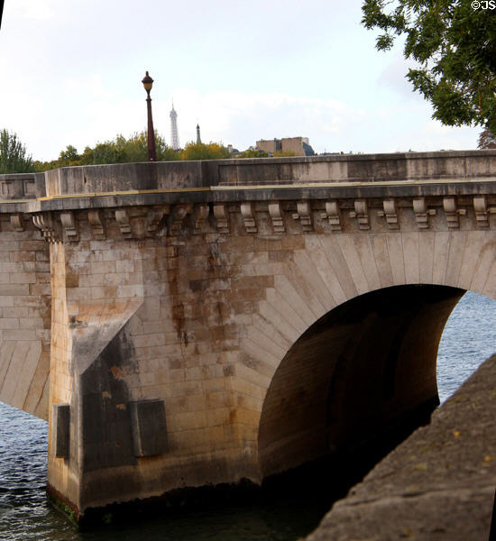 Stone arches of Pont Marie (17thC) between Île St Louis & right bank. Paris, France.