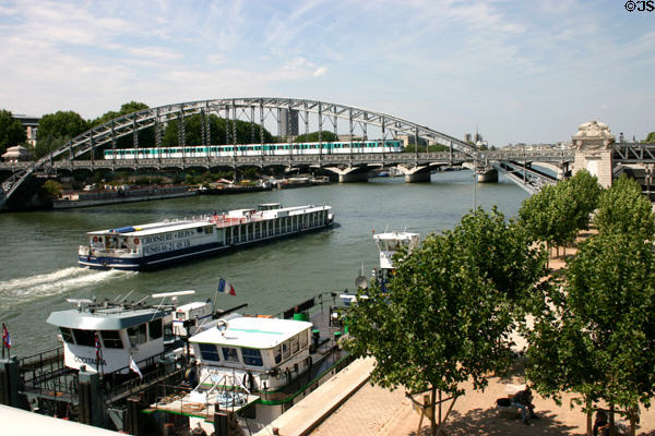 Metro train crosses Viaduc d'Austerlitz over Seine River. Paris, France.