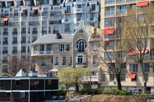 Mix of old & new luxury residences along Seine near Pont Rouelle. Paris, France.