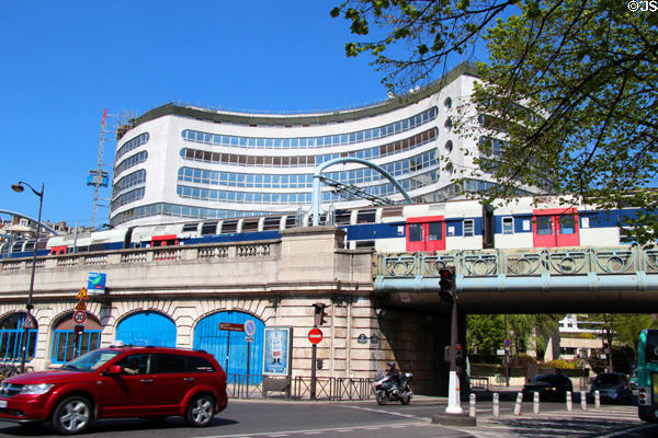 Pont Rouelle SNCF rail bridge crosses over Ave. President Kennedy with Passy-Kennedy Building beyond. Paris, France.