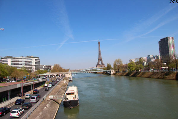 Seine with Radio France (ORTF) round building, Pont de Grenelle, Eiffel Tower & Residential towers. Paris, France.