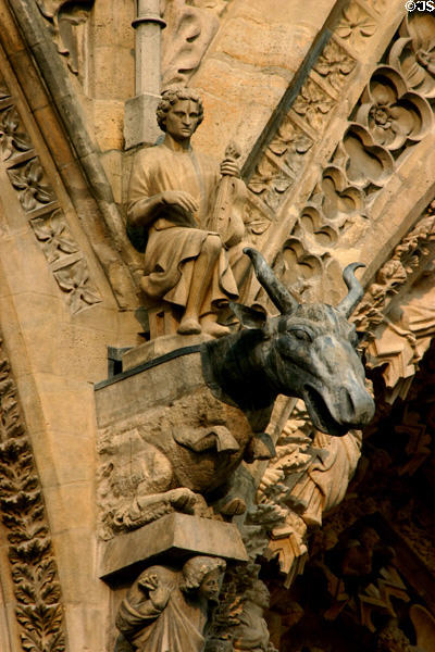 Moose-like beast & violin player on Cathedral. Reims, France.