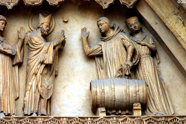 Carving of blessing of wine on Cathedral. Reims, France.