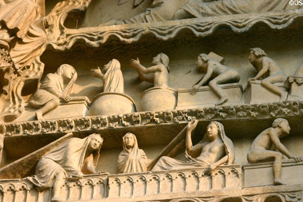 Dead arising from their tombs in Last Judgment scene on Cathedral. Reims, France.