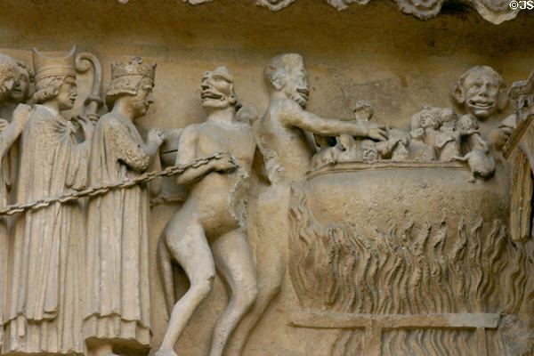 Bishops, rich & kings being thrown into burning vats of hell in Last Judgment scene on Cathedral. Reims, France.