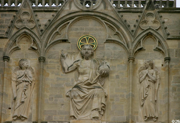 Christ with orb & angels on facade of St Stephen's Cathedral. Sens, France.