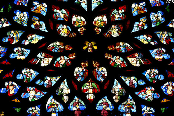 North transept rose stained glass window of St Stephen's Cathedral with Christ & angels. Sens, France.