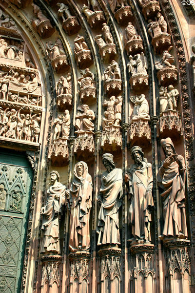 Saints, apostles & evangelists to right of central door of Cathedral. Strasbourg, France.