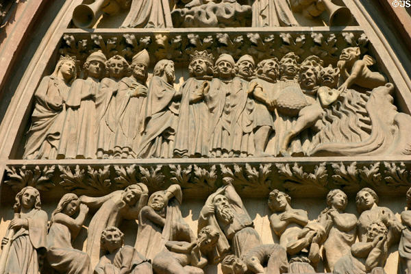 Kings, bishops & rich being sent to hell over right door of Cathedral. Strasbourg, France.